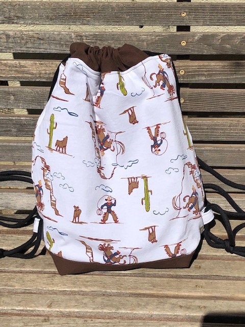 Cowboy Western Drawstring backpack, a fun accessory for any outfit, Canvas lined and bottom for durability, inside pocket