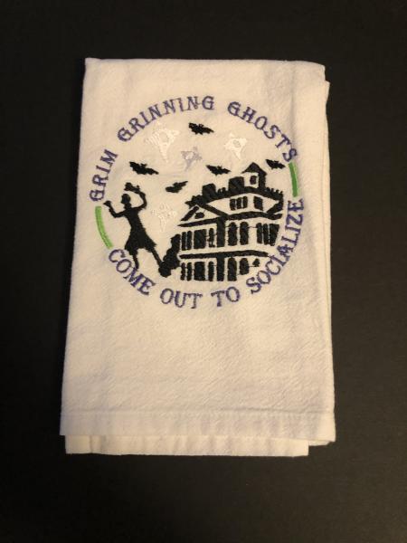 Grim Grinning Ghost Haunted Mansion is embroidered on a white flour sack tea towel, dish towel, cotton,