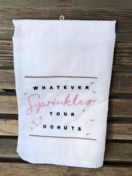 Whatever sprinkles your donuts is embroidered on a white flour sack tea towel, dish towel, cotton