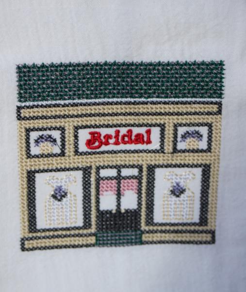 Bridal Store in a cross stitch style embroidered on a white tea towel, dish towel, flour sack, cotton, large picture