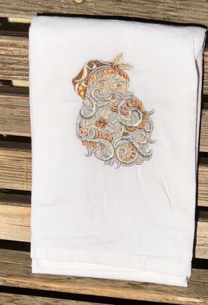 A Christmas Santa is embroidered on a white flour sack tea towel, dish towel, cotton picture