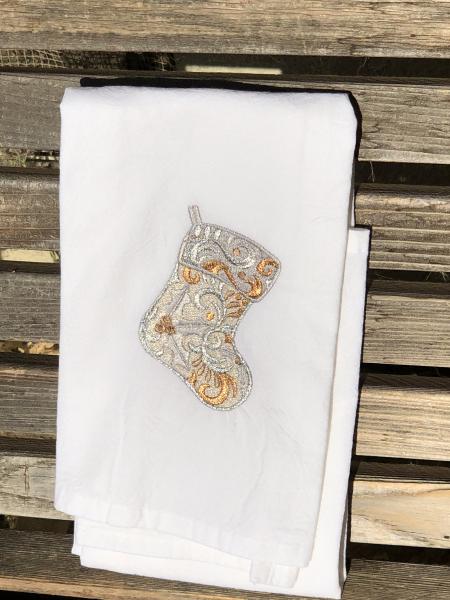 A Christmas Stocking is embroidered on a white flour sack tea towel, dish towel, cotton picture