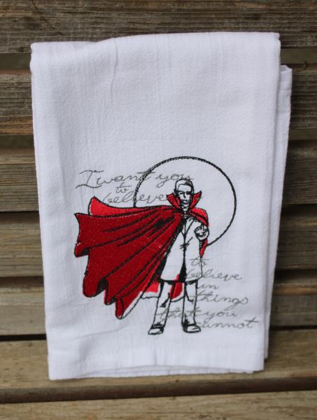 A Beautifully drawn stylized Count Dracula is embroidered on a white flour sack tea towel, dish towel, cotton
