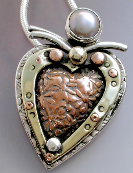 Layered mixed metal heart pendant