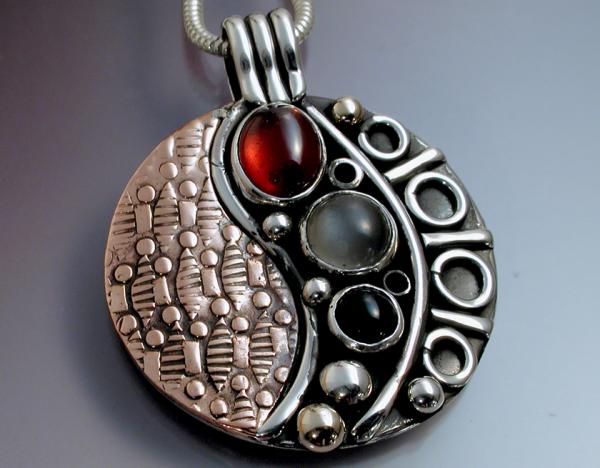 Yin Yang circular textured pendant.