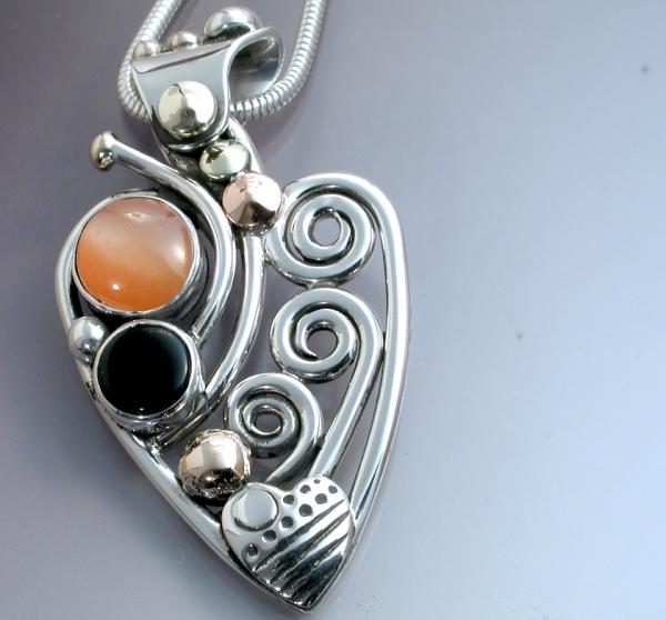 Black onyx and moonstone heart pendant