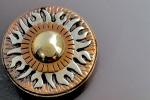 A multi layered Sun Pin/Pendant
