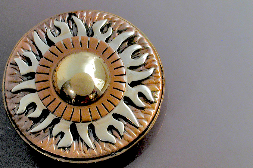 A multi layered Sun Pin/Pendant