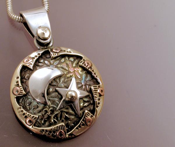 Spinning Sun, Star & Moon Pendant