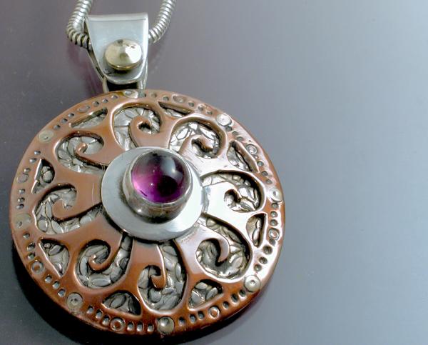 A Mandala form Pendant with Amethyst