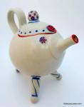 Tripod Teapot, a whimsical ceramic teapot with tripod base, rattle lid