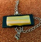 Yellow on black glass pendant