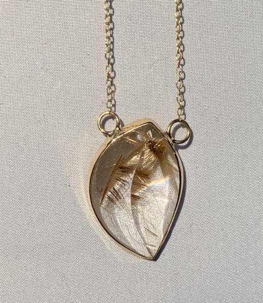 14k yellow gold and rutillated quartz necklace.