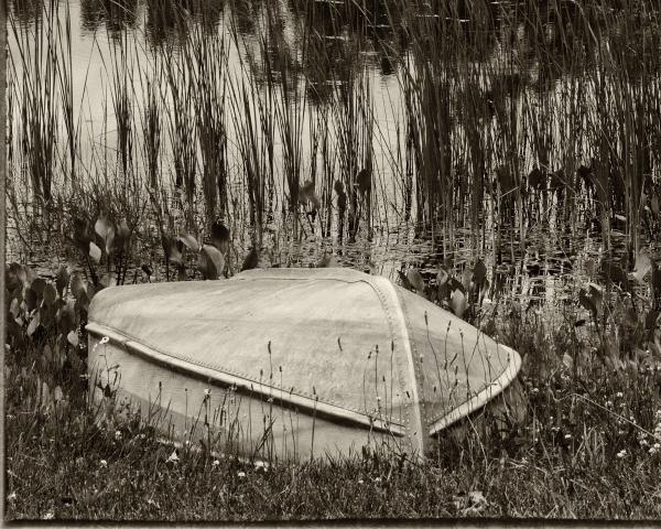 Boat at the old Fishin' Hole, Black & White Print with a black mat. picture