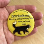Signed Snarky Cat Quote Button - Never Insult A Cat