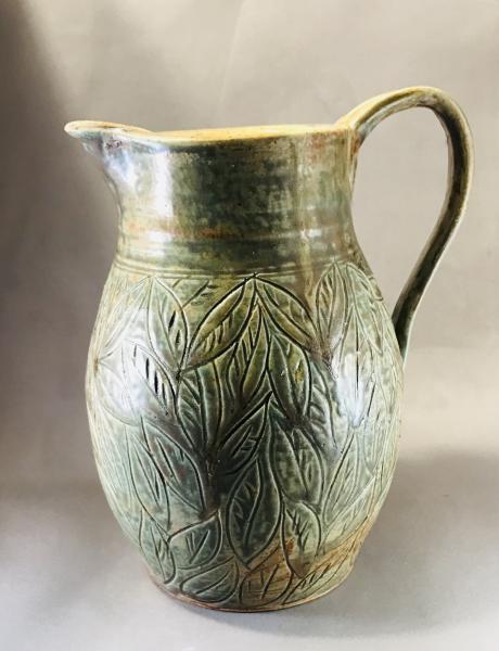 Carved pitcher