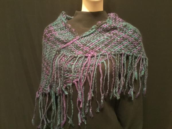 Handwoven triangular shawl with braided fringe