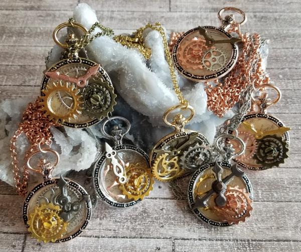 Steampunk Gold, Copper, Silver & Antique Bronze Gears in Resin in Vintage Watch Shaped Pendant picture