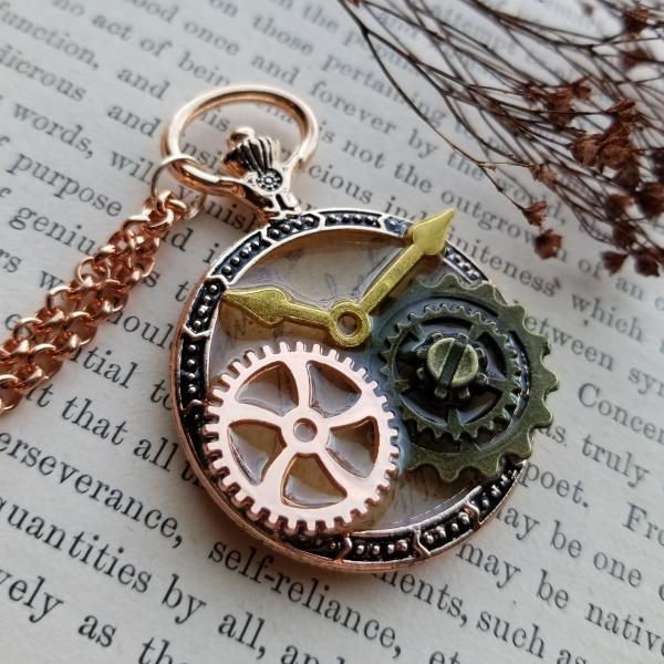 Steampunk Copper, Gold, & Antique Bronze Gears in Resin in Vintage Watch Shaped Pendant picture