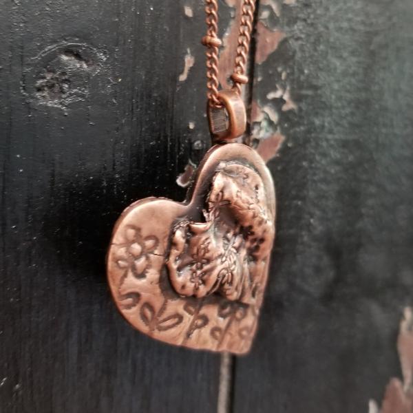 Solid Copper Flower Heart on Heart Necklace picture