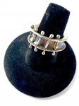 Patinated ring with inset balled wires