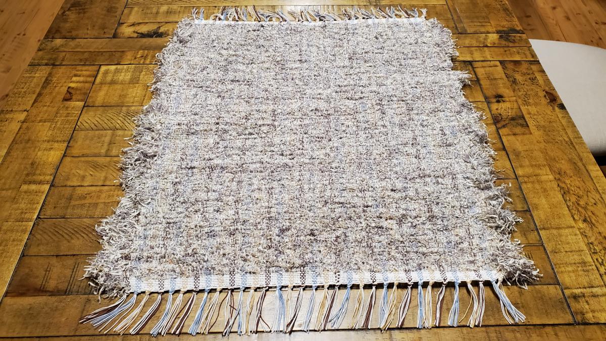 Handwoven silver/beige material floor rug #B329 picture
