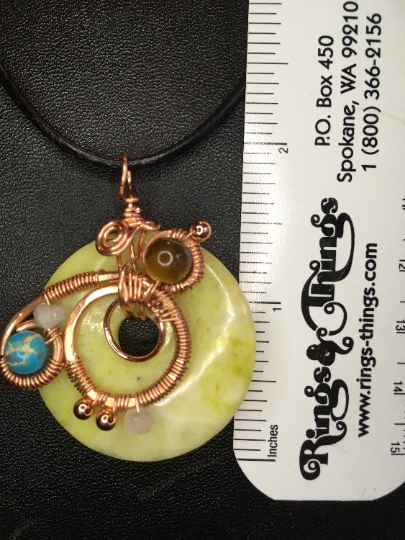 Yellow Serpentine Donut Pendant with Copper Free Form Wire Artwork and Stone Accents - Jewelry with Purpose picture