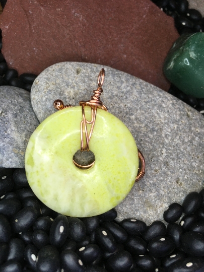 Yellow Serpentine Donut Pendant with Copper Free Form Wire Artwork and Stone Accents - Jewelry with Purpose picture