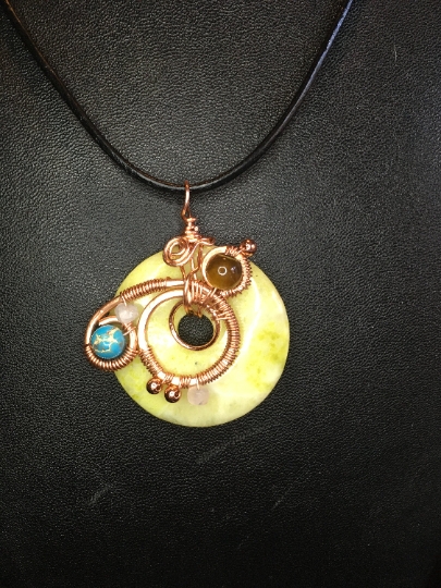 Yellow Serpentine Donut Pendant with Copper Free Form Wire Artwork and Stone Accents - Jewelry with Purpose picture