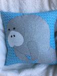 Grey manatee appliqué pillow