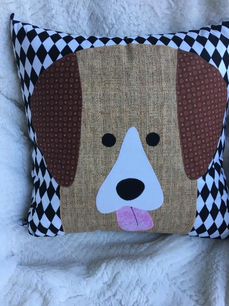 Brown dog appliqué on black and white diamond patterned background pillow