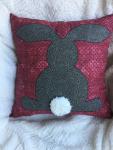 Rabbit appliqué on burgundy pillow