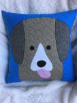 Brown dog appliqué on royal blue dot background pillow