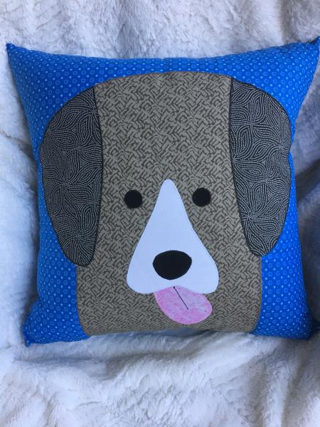 Brown dog appliqué on royal blue dot background pillow picture