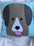 Brown dog on mint snowflake. Background pillow