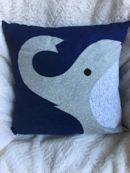 Elephant pillow on navy tone on tone background