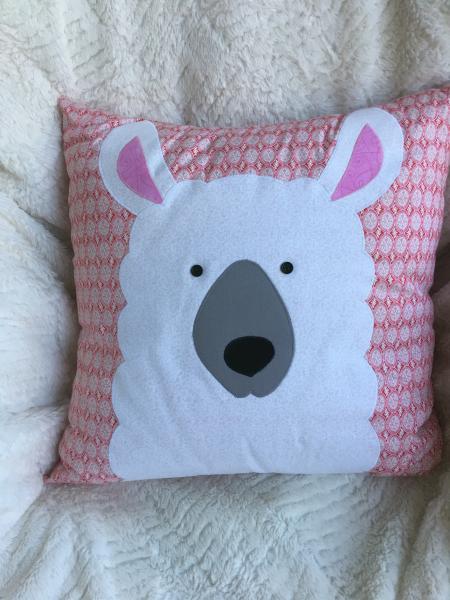 Llama appliqué on pink/white pillow picture