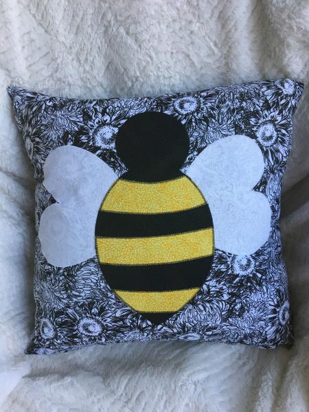 Bumblebee appliqué on black/white pillow