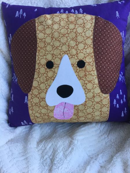 Brown and tan dog appliqué on purple and white background pillow picture