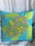 Sea turtle appliqué on light teal pillow