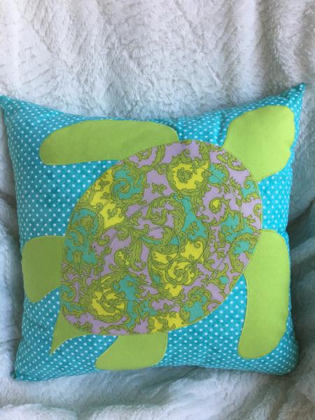 Sea turtle appliqué on light teal pillow picture