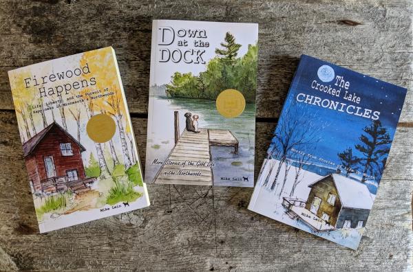 Set of all three award wining books - Firewood Happens, Down at the Dock, and The Crooked Lake Chronicles picture