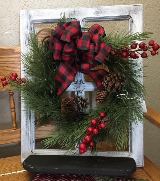 White window with Christmas wreath picture