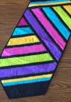 Small bright colored striped table runner