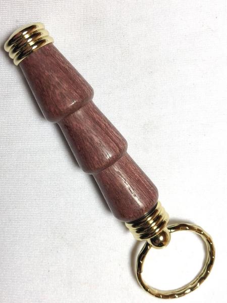 Secret compartment keychains, made with various woods or acrylics.