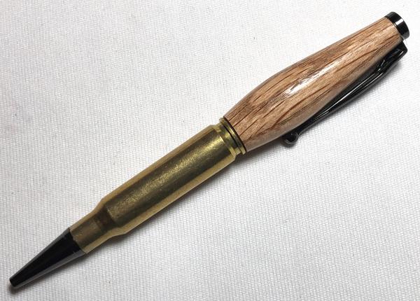 308 caliber bullet pen made with oak and a genuine casing