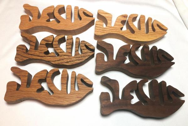 Jesus fish scroll sawed from solid oak or walnut.