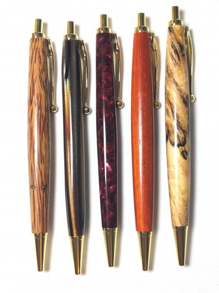 Slimline Click style, made with various woods or acrylics, gold hardware.