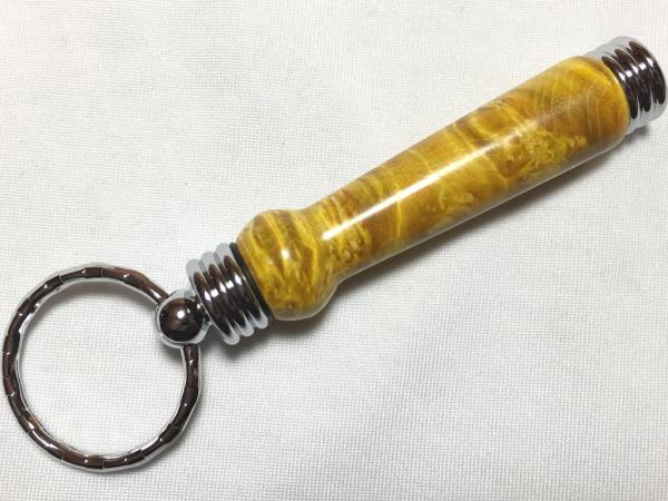 Secret compartment keychains, made with various woods.