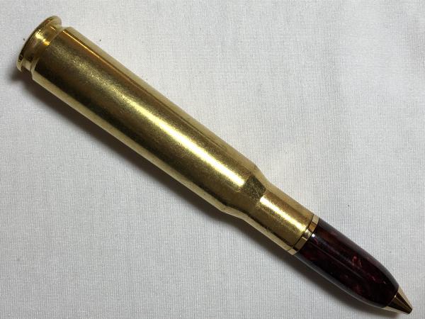 50 caliber machine gun bullet pen made with various acrylics, gold hardware, and a genuine casing